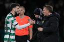 Celtic winger Mikey Johnston shakes Brendan Rodgers' hand during the Hibernian game on Wednesday night