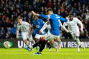 Rangers captain James Tavernier takes his penalty against Dundee at Ibrox on Saturday as Amadou Bakayoko, right, looks on