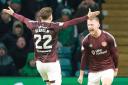Stephen Kingsley, right, celebrates scoring against Celtic at Parkhead on Saturday with his Hearts team mate Aidan Denholm