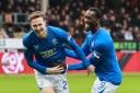 Kieran Dowell, left, celebrates his goal against Motherwell with Abdallah Sima at Fir Park today