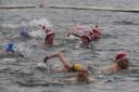 Members of the Serpentine Swimming Club take part in the Peter Pan Cup race, which is held every Christmas Day at the Serpentine, in Hyde Park, central London
