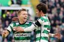 Celtic right back Alistair Johnston, left, celebrates scoring his first goal at Parkhead with his team mate Matt O'Riley in the cinch Premiership game against Ross County this afternoon