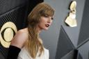 Taylor Swift arrives at the 66th annual Grammy Awards in February