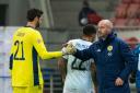 Scotland manager Steve Clarke, right, shakes hands with Craig Gordon after a game