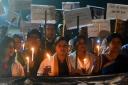 Women hold placards during a candle march seeking justice for rape-murder cases in 2019 in Patna, India. Picture: Parwaz Khan/Hindustan Times via Getty