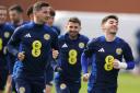 Billy Gilmour, right, enjoys a laugh with Kenny McLean in Scotland training this week