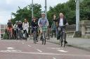 Green minister Patrick Harvie cycles with others on the opening of the South City Way