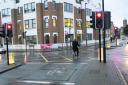 A cyclist goes through a red light at the junction of St Aldate's and Thames Street