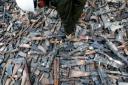 Rifles and pistols seized from drugs cartels and destroyed by members of the Mexican army