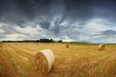 Panorama of straw bales in a field under a dramatic, stormy sky. Rural Scotland between Elgin and Lossiemouth.; Shutterstock ID 158703602; PO: 4/05/14; Job: essay; Client: sunday herald (34579351)