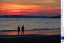 Mandatory Credit: Photo by George Sweeney/REX Shutterstock (4842929a)
A young couple walk on Buncrana beach as sun sets over Lough Swilly
Sunset over Lough Swilly, Donegal, Ireland - 11 Jun 2015

 (38808543)