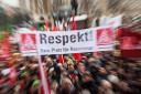 epa05104816 Demonstrators hold up a banner written with 'Respect! No place for racism',  during a rally against racism and violence on Schlossplatz square in Stuttgart, Germany, 16 January 2016. An alliance of more than 20 organizations from politics, un
