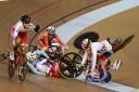 Katie Archibald and team-mate Manon Lloyd crash on their way to winning gold in the Madison at the UCI Track Cycling World Cup in Glasgow Photograph: Rob Hardie/Touchline Images
