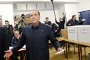 Italian former premier and leader of Forza Italia party Silvio Berlusconi at a polling station in Milan, Italy, Sunday, March 4, 2018. Analysts predict the only coalition with a shot of reaching an absolute majority is the centre-right coalition anchored