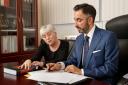 Clara Ponsati and her lawyer Aamer Anwar in his Glasgow office.