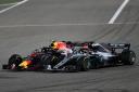 BAHRAIN, BAHRAIN - APRIL 08:  Max Verstappen of the Netherlands driving the (33) Aston Martin Red Bull Racing RB14 TAG Heuer battles with Lewis Hamilton of Great Britain driving the (44) Mercedes AMG Petronas F1 Team Mercedes WO9 on track during the Bahra
