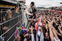 MONTMELO, SPAIN - MAY 13:  Race winner Lewis Hamilton of Great Britain and Mercedes GP celebrates with his fans on the pit wall after the Spanish Formula One Grand Prix at Circuit de Catalunya on May 13, 2018 in Montmelo, Spain.  (Photo by David Ramos/Get