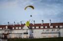 Greenpeace flies a paraglider over Turnberry as Donald Trump visits his Scottish golf course. The paraglider carried a banner bearing the message ‘TRUMP: WELL BELOW PAR.'