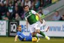 Hibernian's Stevie Mallan (Right) is tackled by Molde's Magnus Wolff Eikrem (Left) during the UEFA Europa League third qualifying round, first leg match at Easter Road, Edinburgh. PRESS ASSOCIATION Photo. Picture date: Thursday August 9, 2018. See