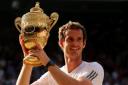 Andy Murray shows off the trophy after being the first Briton to win Wimbledon in 77 years
