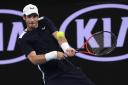 Britain's Andy Murray makes a backhand return to Spain's Roberto Bautista Agut during their first round match at the Australian Open tennis championships in Melbourne, Australia, Monday, Jan. 14, 2019. (AP Photo/Andy Brownbill).