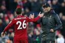 LIVERPOOL, ENGLAND - FEBRUARY 09: Jurgen Klopp, Manager of Liverpool is celebrates victory with Andy Robertson of Liverpool after the Premier League match between Liverpool FC and AFC Bournemouth at Anfield on February 9, 2019 in Liverpool, United Kingdom
