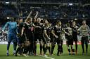 Ajax players celebrate after the Champions League round of 16 second leg soccer match between Real Madrid and Ajax at the Santiago Bernabeu stadium in Madrid, Tuesday, March 5, 2019. Ajax won 4-1. (AP Photo/Bernat Armangue).