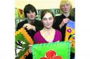 Business sense: Chris Harris, Emily Wilson and Robin Graham from Genesis at Sir William Borlase's Grammar School promote hand-painted place mats from South Africa