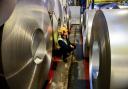 File photo dated 15/02/17 of a worker inspecting rolls of steel. Britain's manufacturers have ended the year at a 