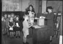 School children getting their powdered milk rations