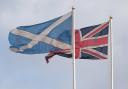 File photo dated 21/03/17 of a Saltire flag and a Union flag flying above Whitehall in Westminster, London, as it is  