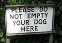 Rod Arnold approves of this pithy sign which dumps on dogs who dump disreputably.