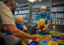 Glasgow Life assistant Gail Hughes, right, taking a Bookbug session at Gorbals library, Glasgow. Pictured joining in is Dylan Stewart, age 18 months, with his grandmother Marie Callaghan. Photograph by Colin Mearns.