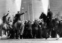 Police horses move in on pickets as coal lorries enter Ravenscraig, 1984