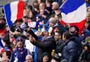 France fans in the stands celebrate during the Guinness Six Nations match at Murrayfield Stadium, Edinburgh. Picture: PA