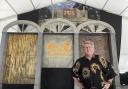 Quint Davis, producer of the New Orleans Jazz & Heritage Festival, stands on a stage of the festival’s Blues Tent on Tuesday, April 26, 2022. The festival opens on Friday, April 28, for the first time in three years, having been postponed in