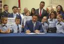 Florida Governor Ron DeSantis signing his Parental Rights in Education Bill last year. It forbids instruction on sexual orientation and gender identity in Florida schools in kindergarten through to third grade. Critics call it the