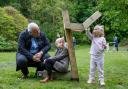 Covid Memorial: Peter McMahon pictured with his grandchildren, Bella and Brodie, next to one of the supports created by artist Alec Finlay.