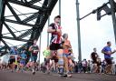 Runners cross the Tyne Bridge during the Great North Run