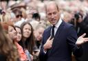 KING'S LYNN, ENGLAND - SEPTEMBER 15: Prince William, Prince of Wales views floral tributes at Sandringham on September 15, 2022 in King's Lynn, England. The Prince and Princess of Wales are visiting Sandringham to view tributes to Queen Elizabeth