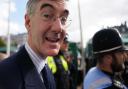 Police officers hold back members of the public as Business Secretary Jacob Rees-Mogg (centre) arrives at the Conservative Party annual conference at the International Convention Centre in Birmingham. Picture date: Sunday October 2, 2022.