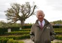 The King in the garden of Dumfries House during a visit there last year when he was Prince of Wales