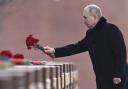 Vladimir Putin lays flowers near the Kremlin Wall on Russia’s  Defender of the Fatherland Day yesterday – the eve of the first anniversary of the invasion of Ukraine