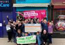 Members of the CWU, the RCN, Living Rent and Glasgow Strike Solidarity at Milk in Glasgow's Govanhill as money raised by selling a calendar is handed over