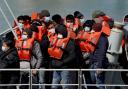 Migrants brought ashore from the English Channel