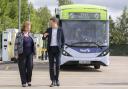 Fiona Hyslop and Graeme Macfarlan with a First Glasgow bus