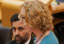 First Minister and SNP leader Humza Yousaf watches circular economy minister Lorna Slater of the Scottish Greens make a statement to MSPs