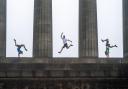 Performers (left to right) Lisa Whitmore, Toffy Paulweber and Jared Shanks from circus company Brainfools during a photocall on Calton Hill in Edinburgh