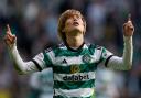 Kyogo Furuhashi celebrates his goal in Celtic's comfortable 3-0 win over Dundee at Parkhead in the cinch Premiership this afternoon