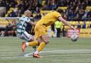 Celtic attacker Daizen Maeda curls a beautiful finish past Shamal George to seal the win at Livingston.